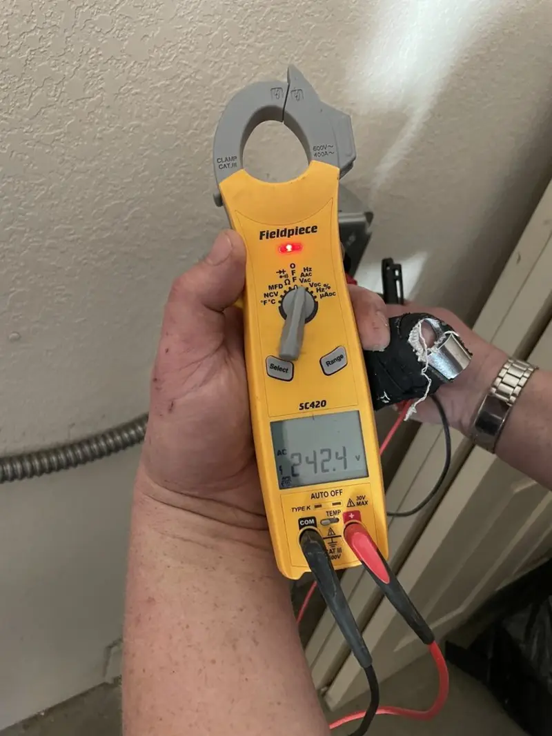 Voltage testing with clamp meter during Aluminum Wiring Replacement in South Park